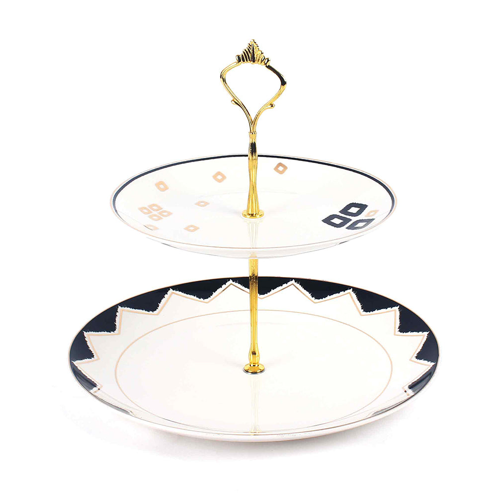 Two-tiered ceramic cake stand with gold accents on a white background. 2 Tier Dessert Platter | Black | Qalla | ICHKAN by Day To Day