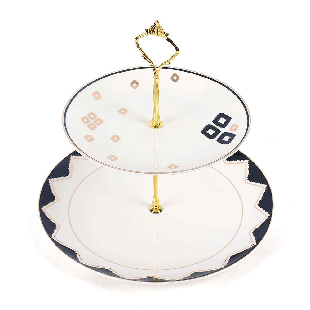 Two-tiered ceramic cake stand with gold accents on a white background. 2 Tier Dessert Platter | Black | Qalla | ICHKAN by Day To Day