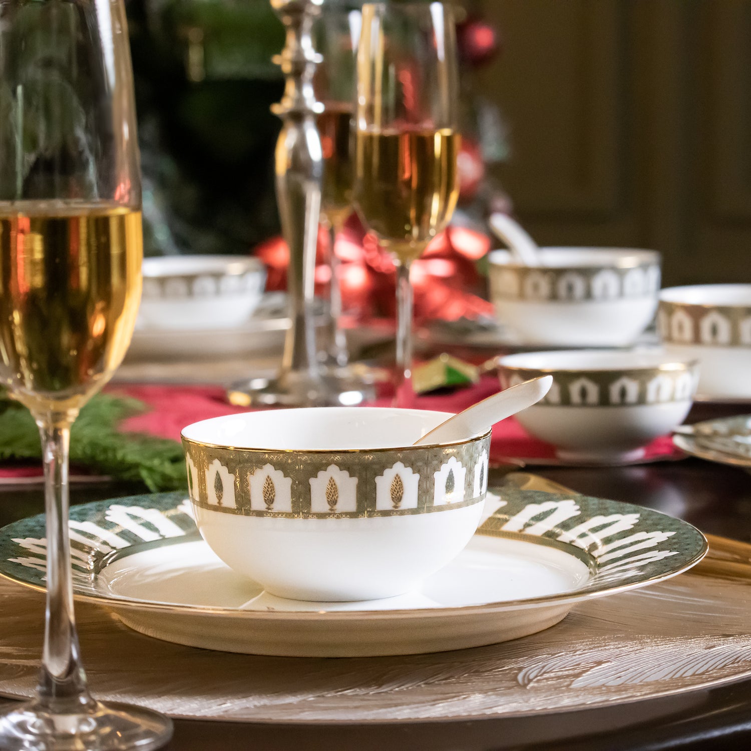 Decorative bowls and plates from CHINAR crockery collection on a table with a festive background